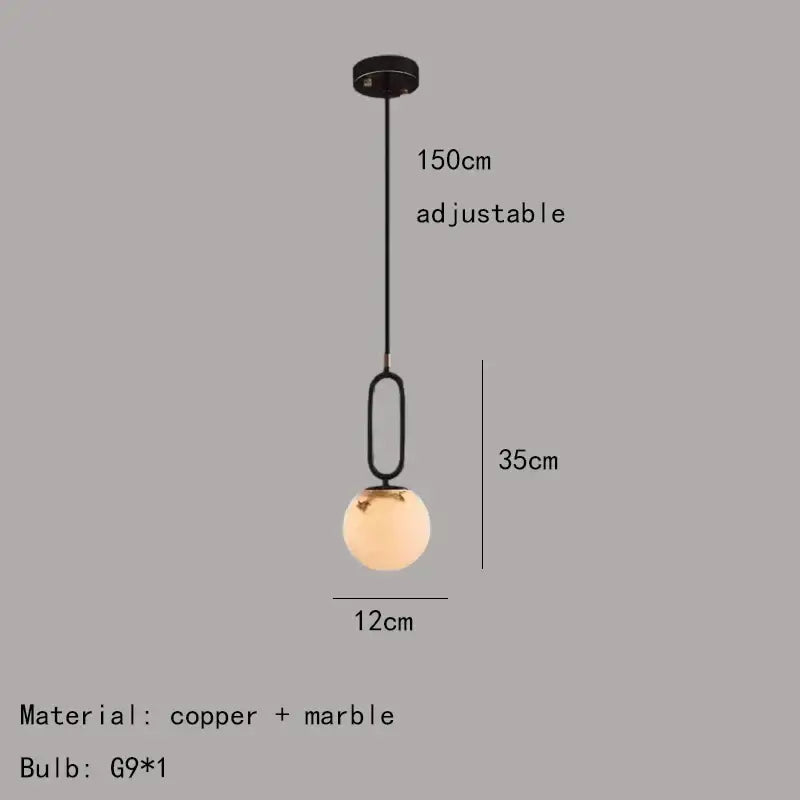 A modern pendant light with black copper and marble finish featuring a frosted glass globe for decorbites brass led