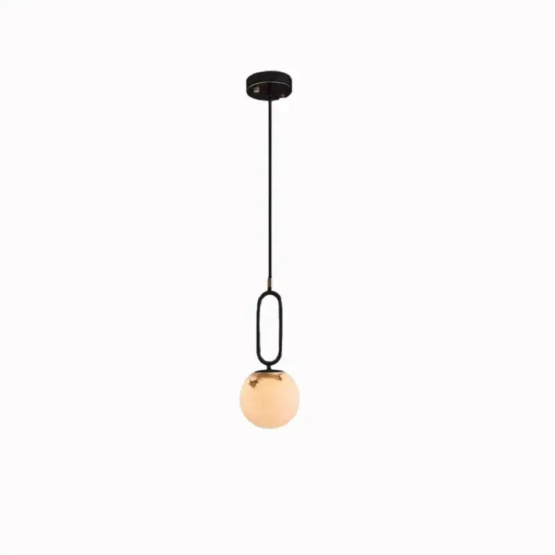 Black metal brass led pendant light with frosted amber glass globe by decorbites for modern kitchen decorbites brass led