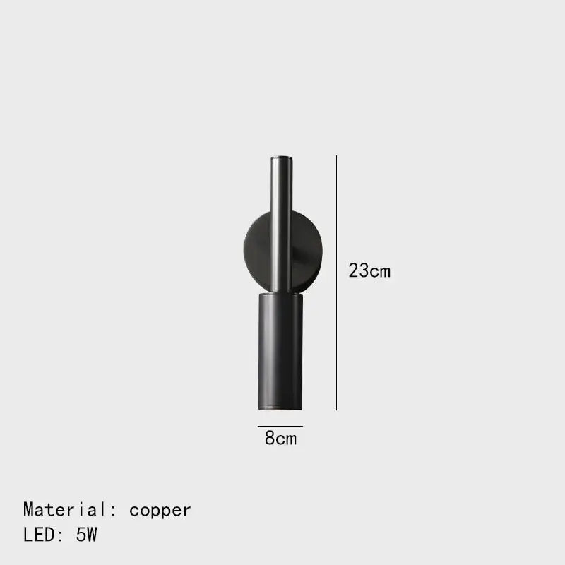 Black copper modern brass led wall lamp with sleek cylindrical design and circular mounting plate for bedroom decorbites brass led wall