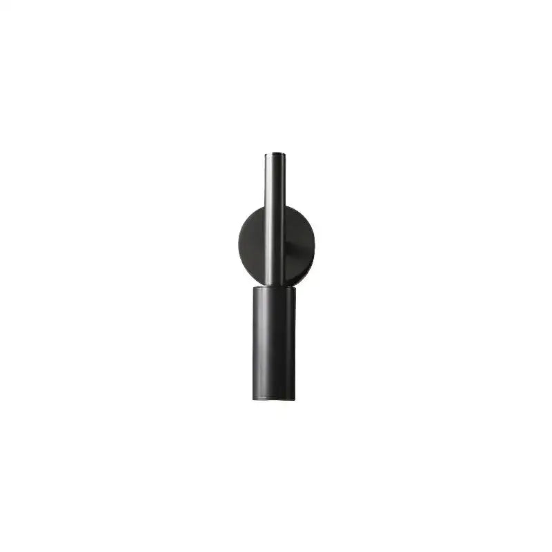 Black minimalist wall lamp with matte finish and cylindrical design from decorbites brass led wall collection
