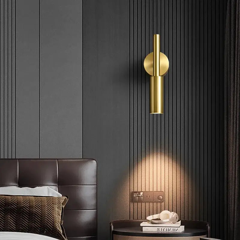 Modern brass led wall lamp with gold-toned rotatable cylindrical sconce and circular mounting plate for decorbites brass led wall decor