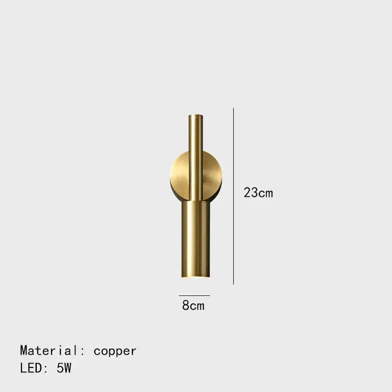 A sleek minimalist copper decorbites brass led wall lamp with a cylindrical stem and circular accent for bedroom decor
