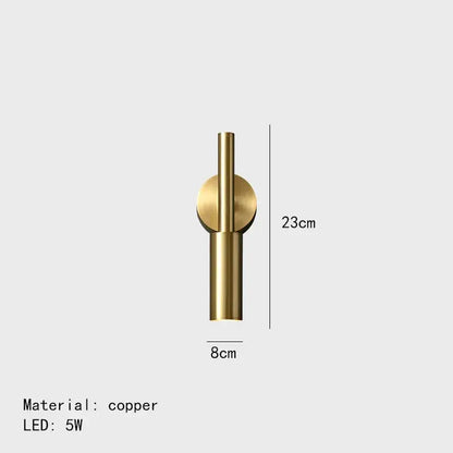 A sleek minimalist copper decorbites brass led wall lamp with a cylindrical stem and circular accent for bedroom decor