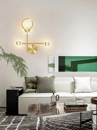 Modern brass led wall light featuring a gold-toned 3 disc sconce in an asymmetrical design for living room decorbites brass led