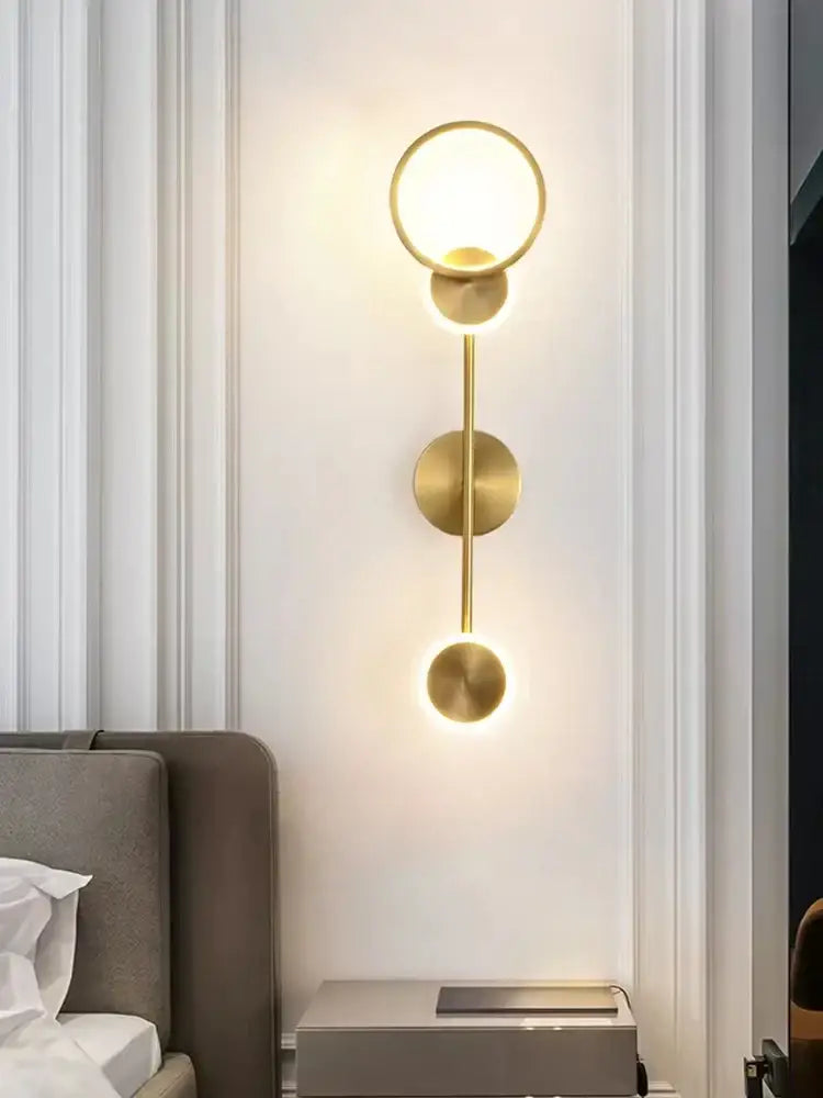 Modern brass led wall light featuring a gold-toned decorbites brass led 3 disc sconce for living room decor
