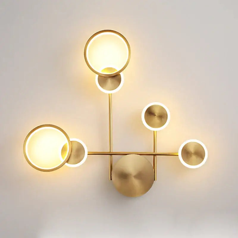 Modern brass led wall light with gold-toned circular fixtures and brushed metal accents for living room decorbites brass led