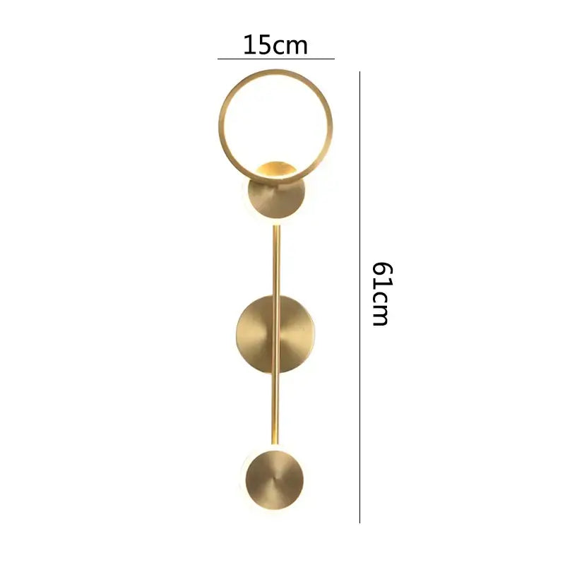 A modern brass led wall light with a gold-toned circular top ring and three disc accents for living room decorbites brass led