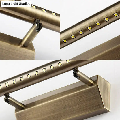 Modern brass led wall mounted light fixture with brass finish, brushed metal, and square-shaped bulbs for bathroom vanity lighting
