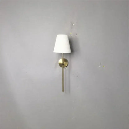 Minimalist modern brass led wall sconce with white fabric shade for bedroom decorbites led wall lighting solution