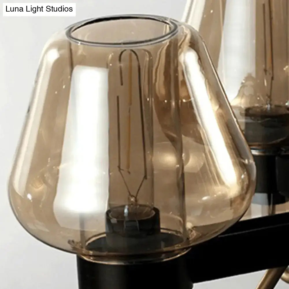 A warm amber glass lampshade encasing a vintage filament bulb in decorbites™ modernist pendant lamp with linear design suitable for 110v-120v and 220v-240v