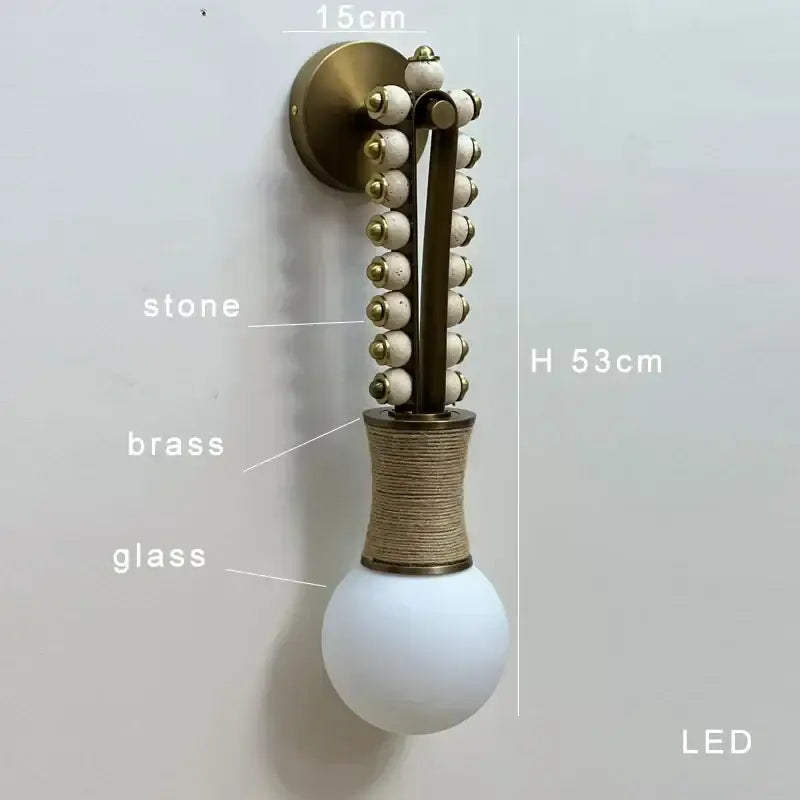 Modern brass marble ball wall sconce with brass base, white stone beads, and opal glass globe for bedroom decorbites brass marble decor