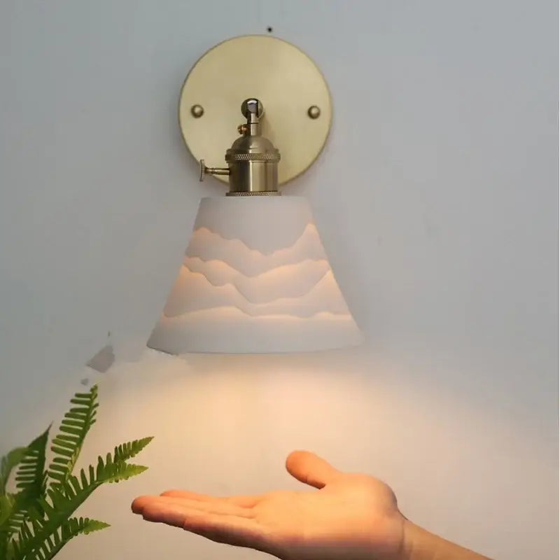 Modern brass mountain led wall lamp sconce with white cloud-patterned glass and brass finish for bedroom or stair lighting