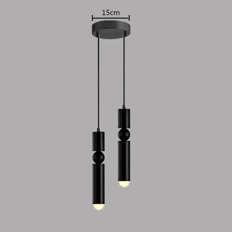 Modern brass pendant light with black cylindrical design and spherical accents featuring warm led bulbs for kitchen decorbites brass pendant