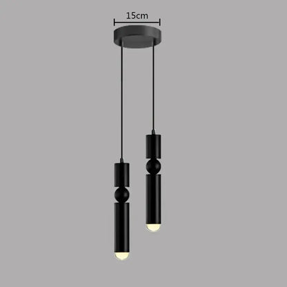 Modern brass pendant light with black cylindrical design and spherical accents featuring warm led bulbs for kitchen decorbites brass pendant