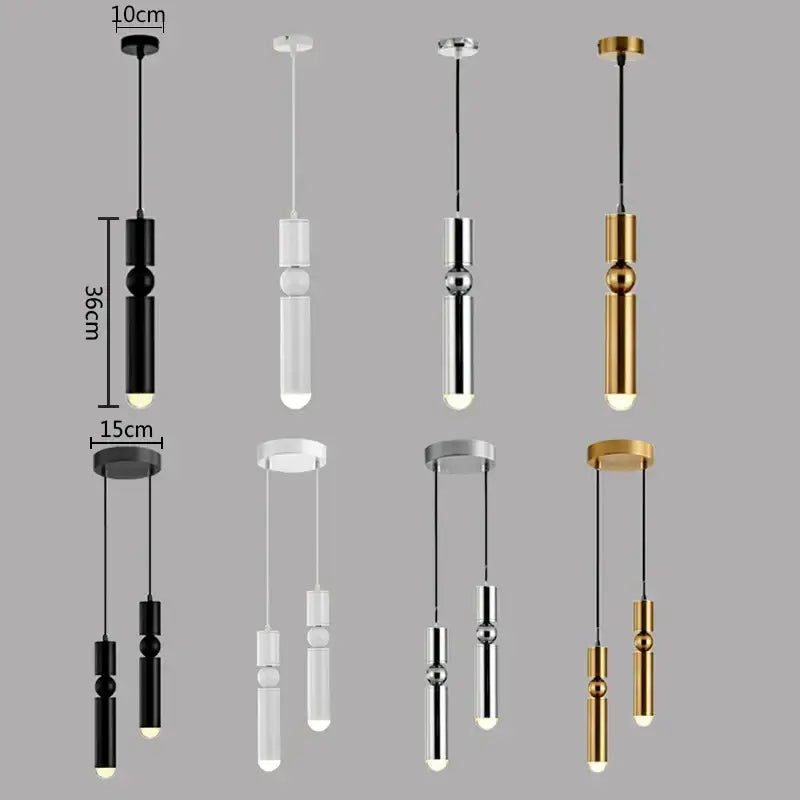 Modern brass pendant light with minimalist black white chrome and gold finishes featuring sleek cylindrical bodies and spheres