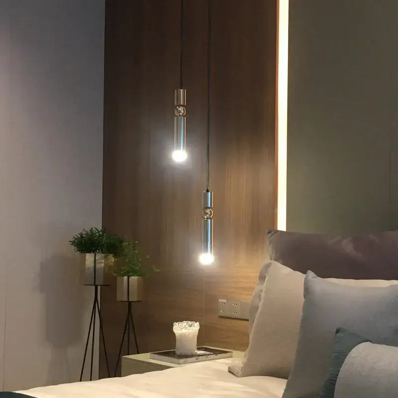 Two sleek modern decorbites brass pendant light fixtures with brushed finish for minimalist kitchen lighting decor