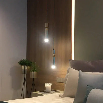 Two sleek modern decorbites brass pendant light fixtures with brushed finish for minimalist kitchen lighting decor