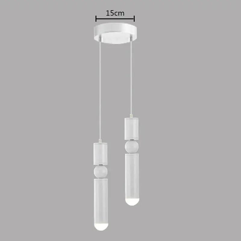 Modern white decorbites brass pendant light with cylindrical and spherical elements for minimalist kitchen decor