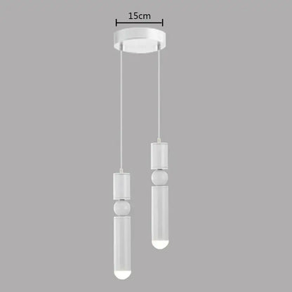 Modern white decorbites brass pendant light with cylindrical and spherical elements for minimalist kitchen decor