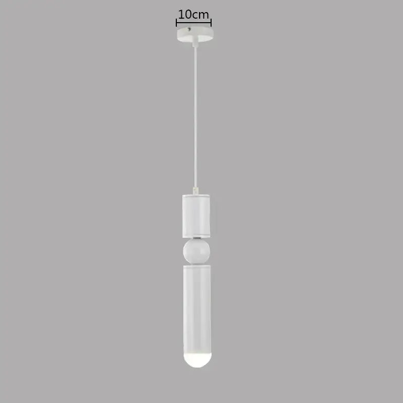 Modern brass pendant light with white cylindrical body and frosted glass diffuser for minimalist kitchen decorbites brass pendant