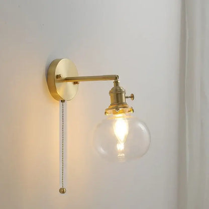 Modern brass ribbed glass ball wall sconce with clear globe and exposed filament bulb for bedroom decorbites glass ball wall