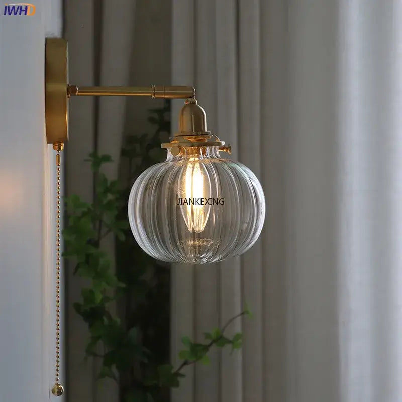 Modern brass ribbed glass ball wall sconce with clear glass globe and exposed filament bulb for bedroom decorbites glass ball wall