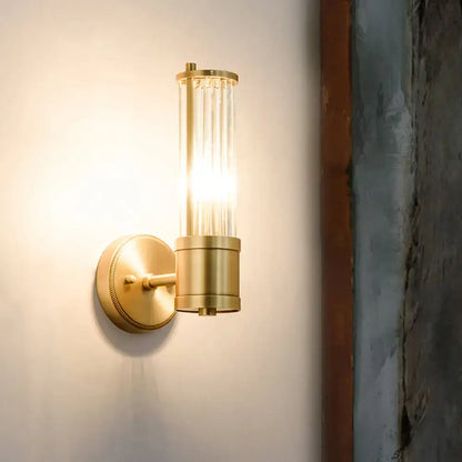 Modern brass ridged crystal wall light with cylindrical glass shade and brass finish wall light fixture height design
