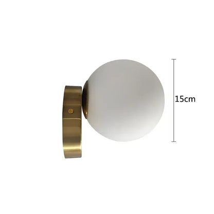 A modern brass round ceiling lamp with a frosted glass round globe for hallway lighting measuring 15cm tall