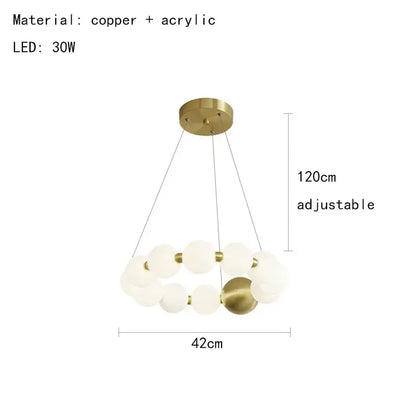 Modern brass round led pendant lights featuring gold-toned copper and acrylic spherical design with adjustable height for dining room decorbites brass round