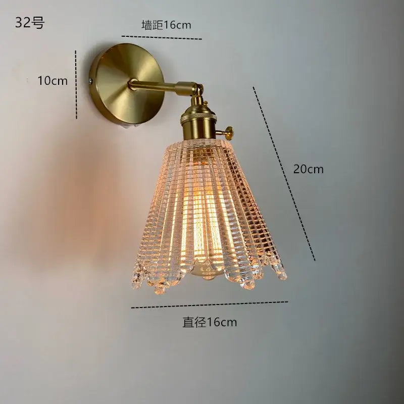 Modern brass wall sconce featuring a ruffled clear glass led shade for elegant decorbites clear glass bathroom lighting