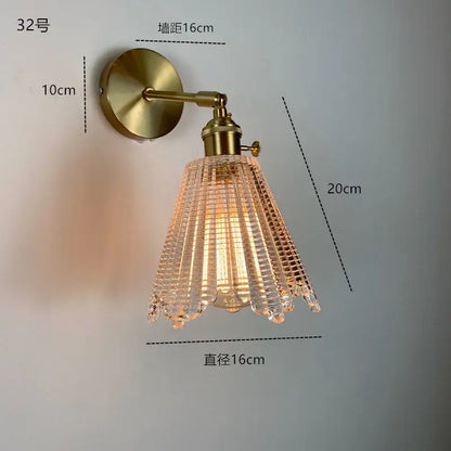 Modern brass wall sconce featuring a ruffled clear glass led shade for elegant decorbites clear glass bathroom lighting