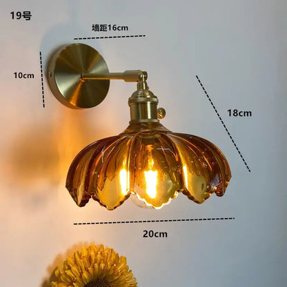 Modern brass wall sconce with amber glass petal-shaped shade clear glass led decorbites bathroom light