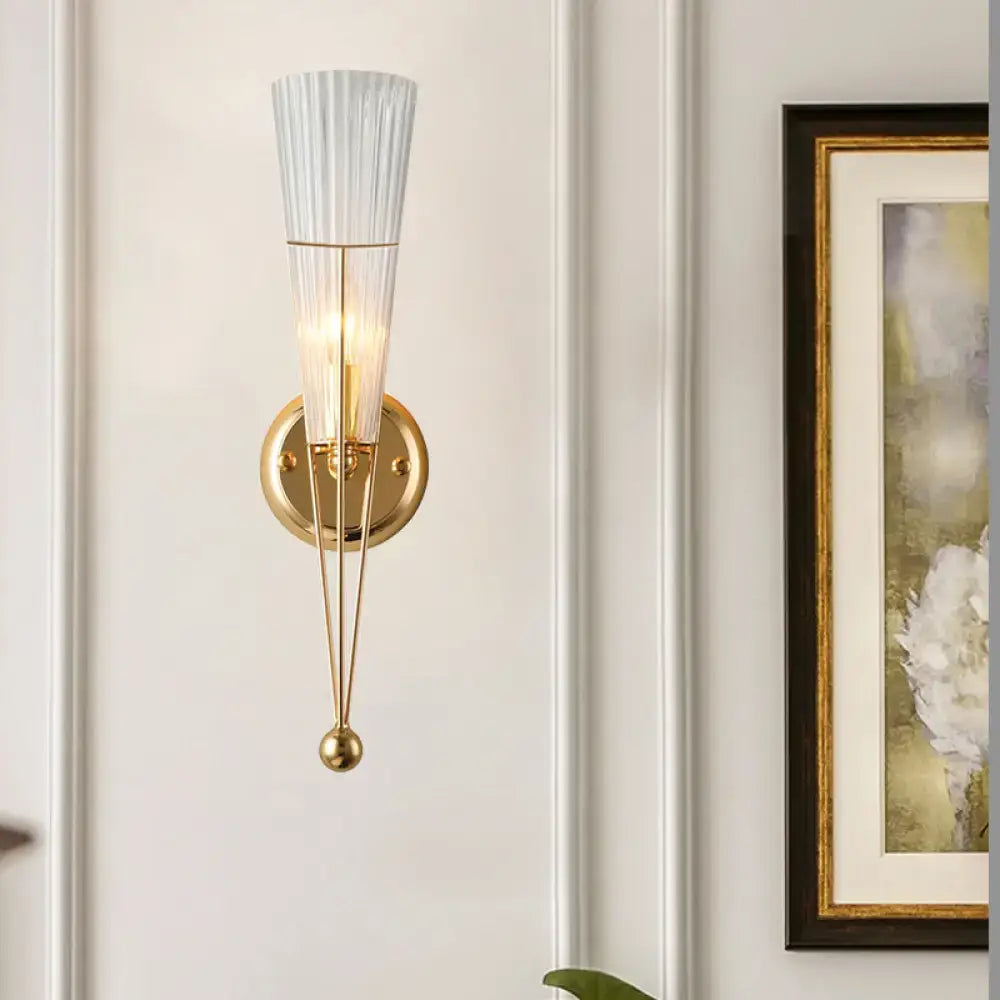 Modern brass sconce light with clear crystal translucent ribbed glass shade and gold-toned e12 e14 fixture for bedroom wall