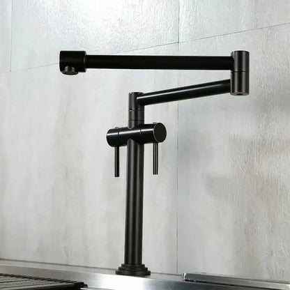 Black matte kitchen faucet with dual handles and articulated design paired with modern brass single handle mixer tap