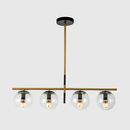Modern brass and smoke grey globe chandelier with four clear glass bulbs for kitchen island lighting in white smoke grey