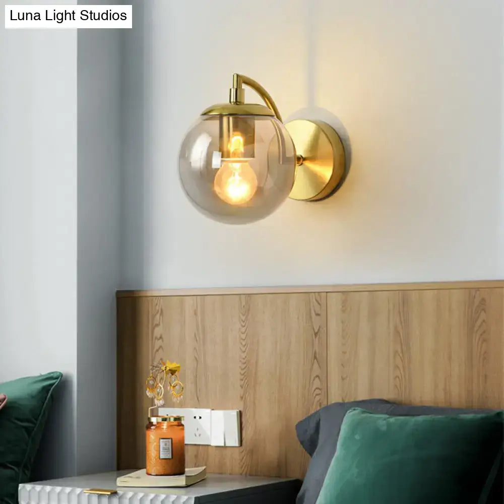 Modern brass stairway wall lighting fixture featuring a gold-toned wall sconce with clear glass globe and e26 e27 bulb