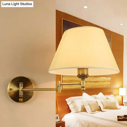 Brass-finished modern swing arm paper wall lamp with cream fabric shade for living room sconce lighting