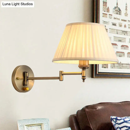 Antique brass swing arm paper wall mount lamp with pleated cream fabric shade for living room lighting