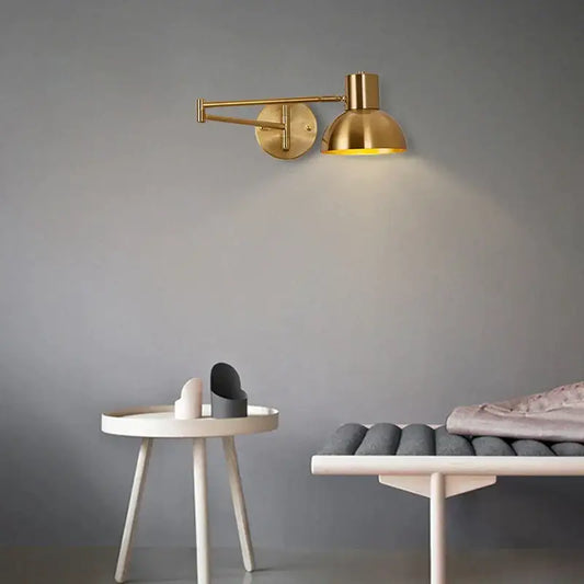Modern brass swing arm wall lamp with adjustable design and warm glow for bedroom decorbites adjustable swing lighting