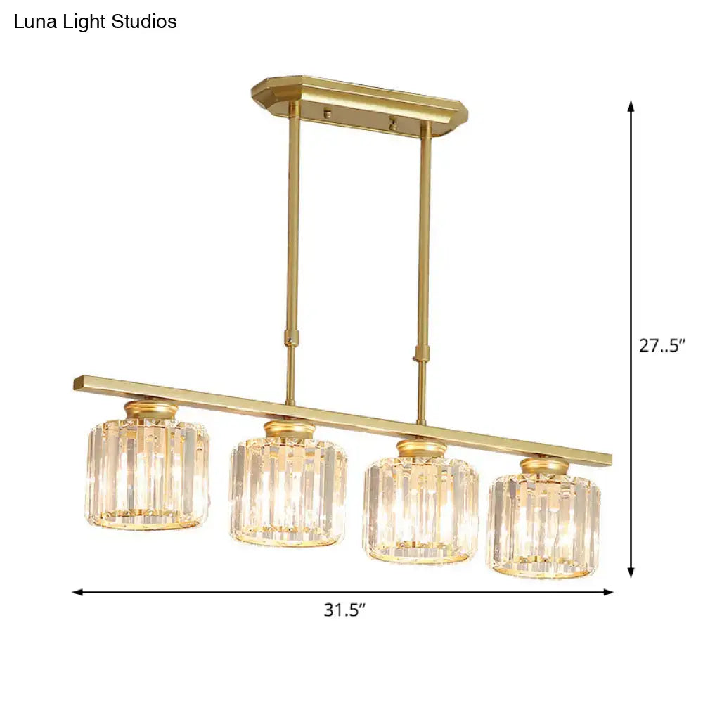 Gold-finished modern brass ceiling pendant with four cylindrical crystal glass shades and adjustable chain cord length for dining room
