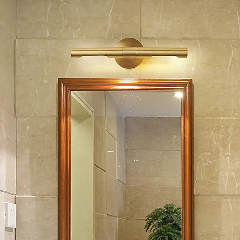 Modern brass tube vanity light wall sconce with a sleek brass finish and tube vanity design for bathroom use