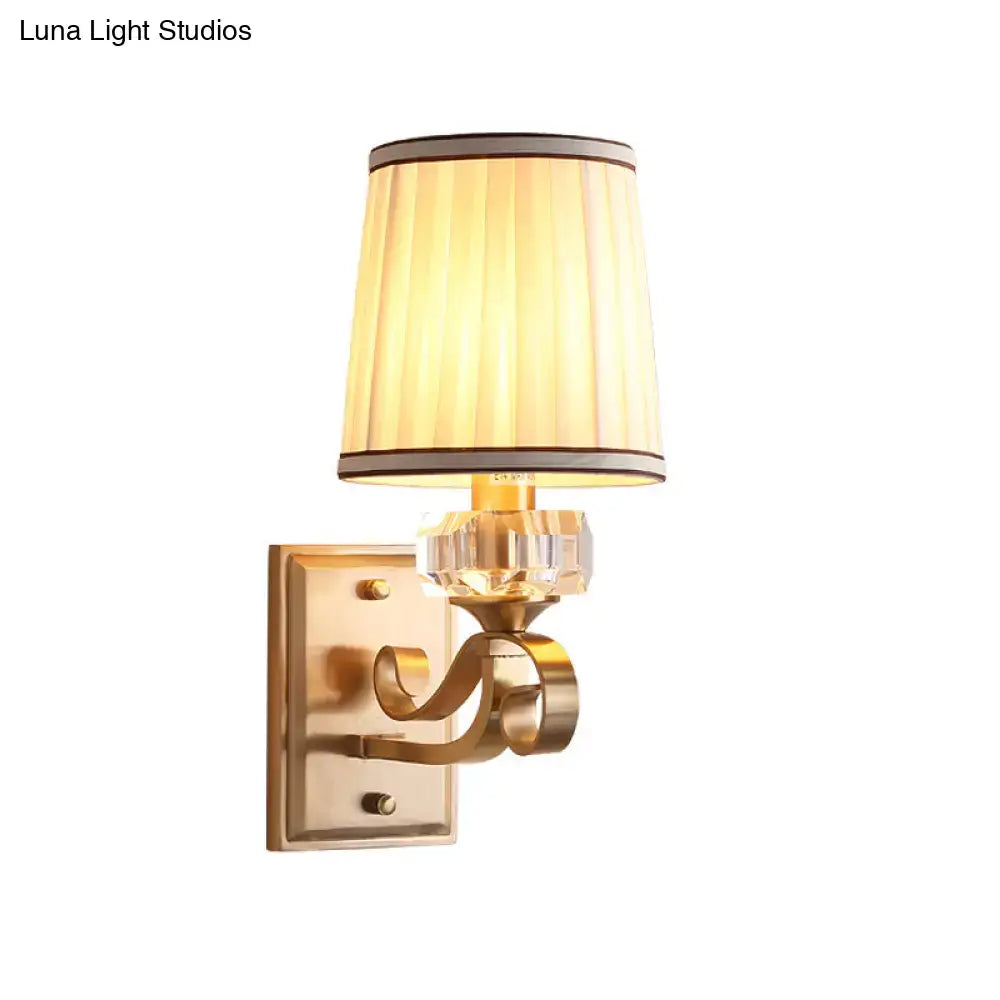 Modern black brass wall lamp with pleated cream shade and crystal accent direct wired electric bedroom sconce