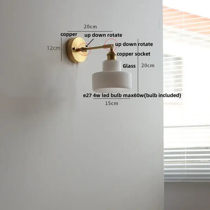 Modern brass wall lamp with clear glass off-white shade and brass copper finish arm for bedroom reading light decorbites clear glass