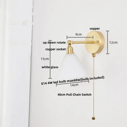 Modern brass wall lamp with clear glass shade, adjustable arm, brass copper finish, and pull chain switch for bedroom reading light