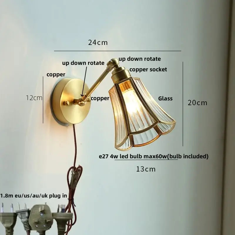 Modern brass wall lamp with brass finish, adjustable arm, copper socket, and clear glass fluted shade for reading light