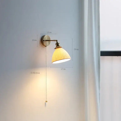 Modern brass wall lamp with ribbed warm yellow glass shade and adjustable pull chain for bedroom reading light decorbites copper arm wall