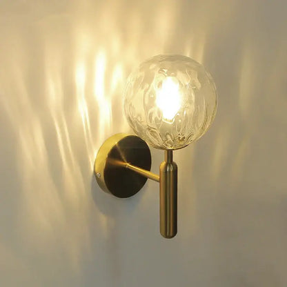 Modern brass wall lights with brass finish wall lamps and decorbites glass ball featuring clear textured glass globe