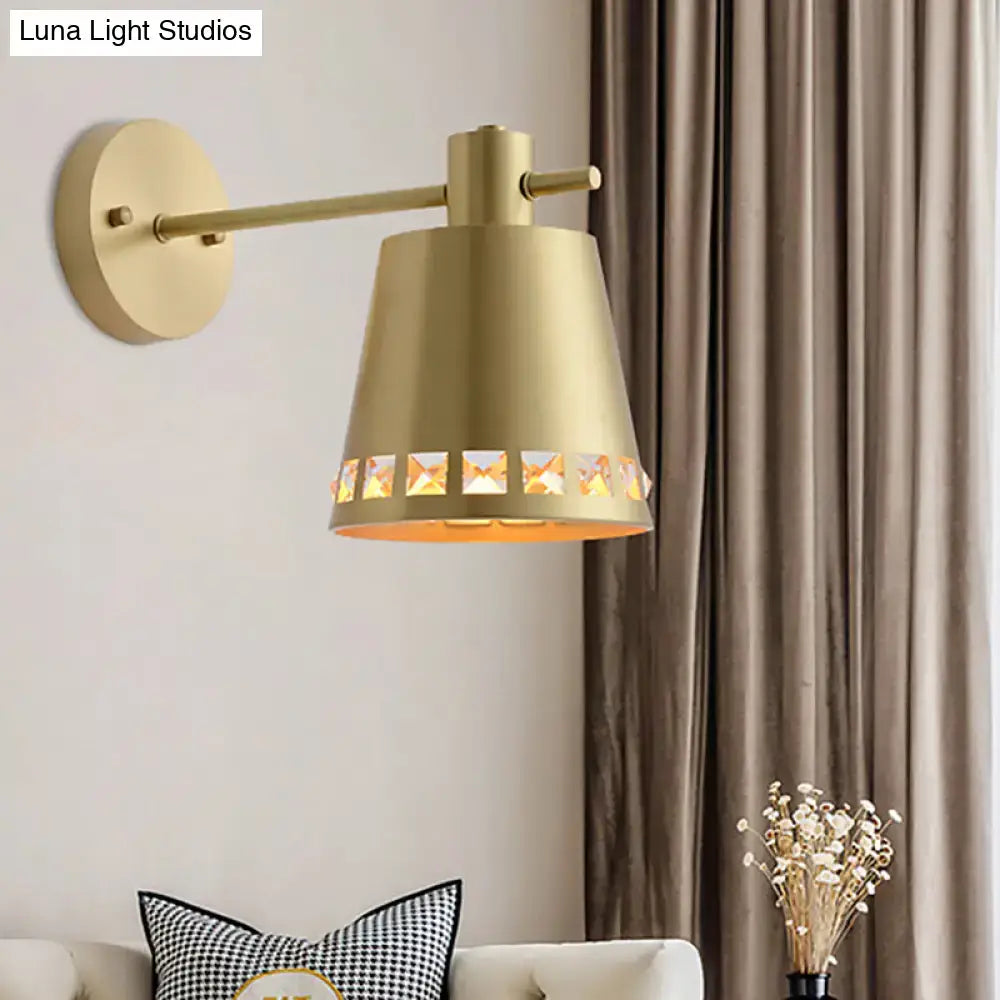 Modern brass wall mount light with gold-toned conical shade and clear crystal accent direct wired electric for living room