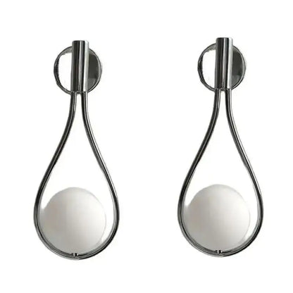Modern brass wall sconce with frosted glass teardrop globes and polished chrome frame for elegant living room decorbites brass wall sconce