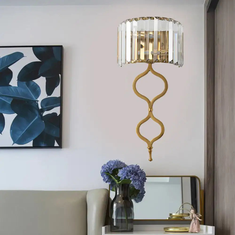 Modern brass wall sconce with crystal rectangle shade and ornate twisted metal base is a great choice for wall mount